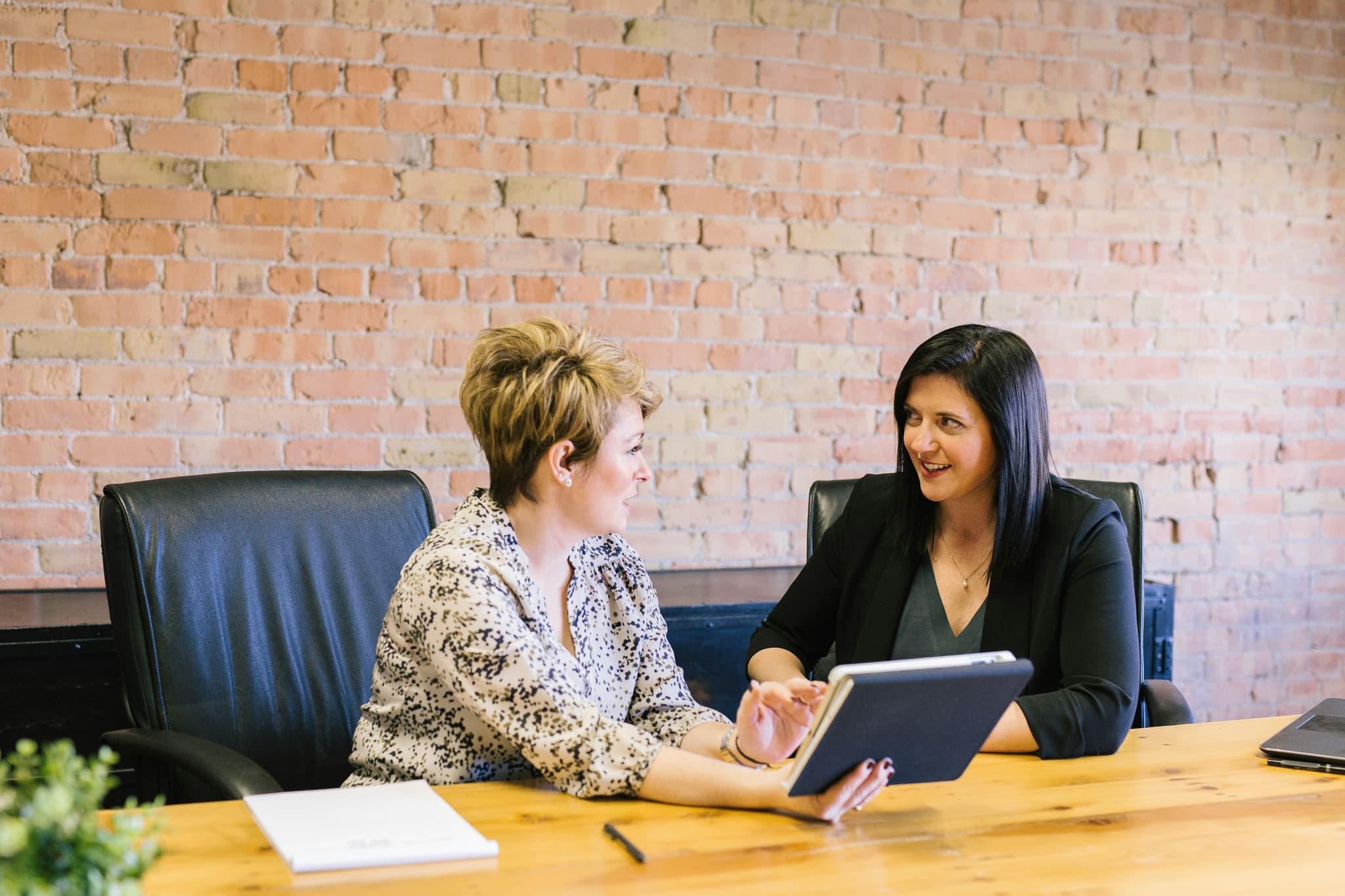 Two professionals collaborating on proposal