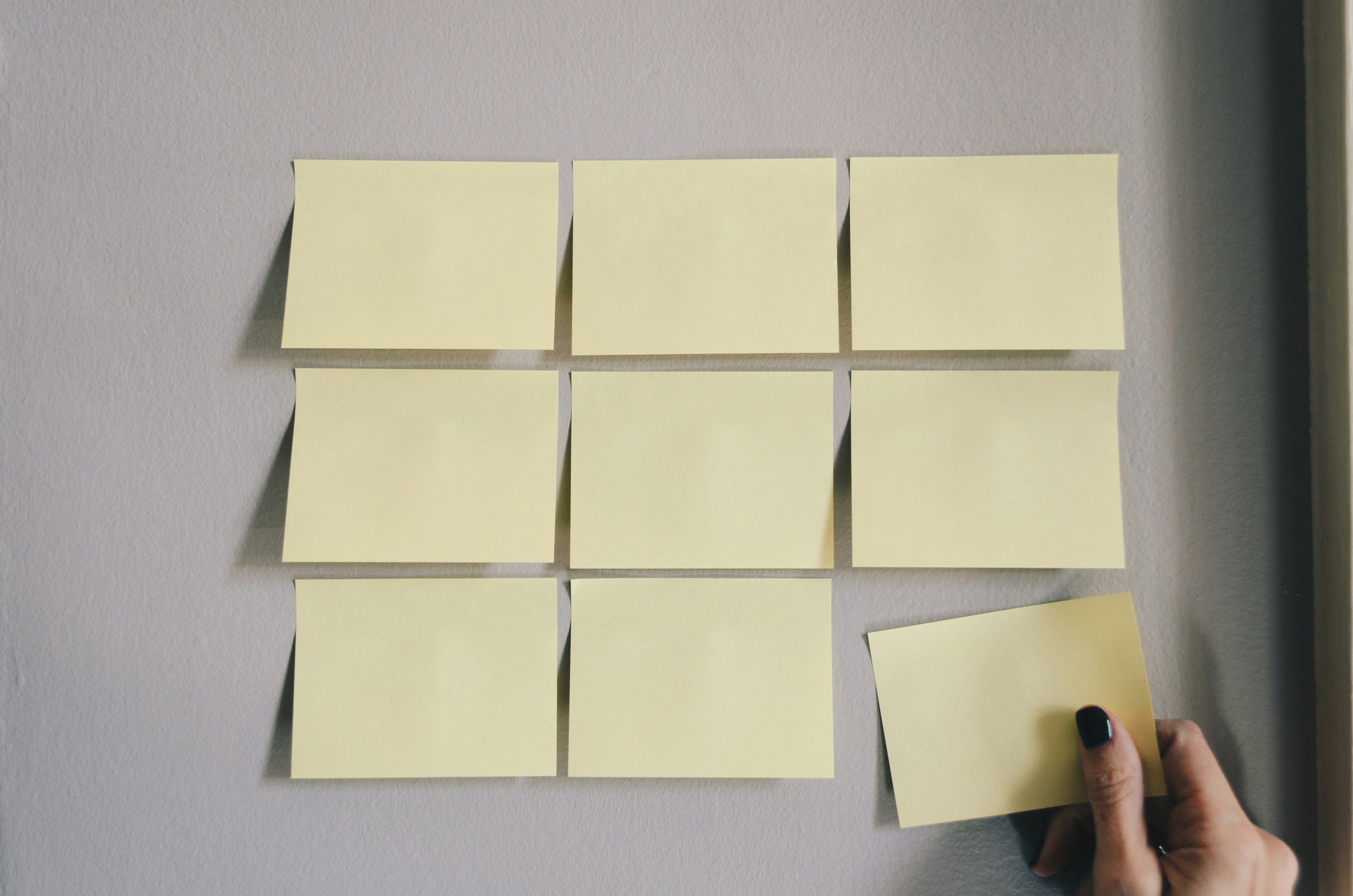 meetings collaboration blank sticky notes on wall for planning and prioritization