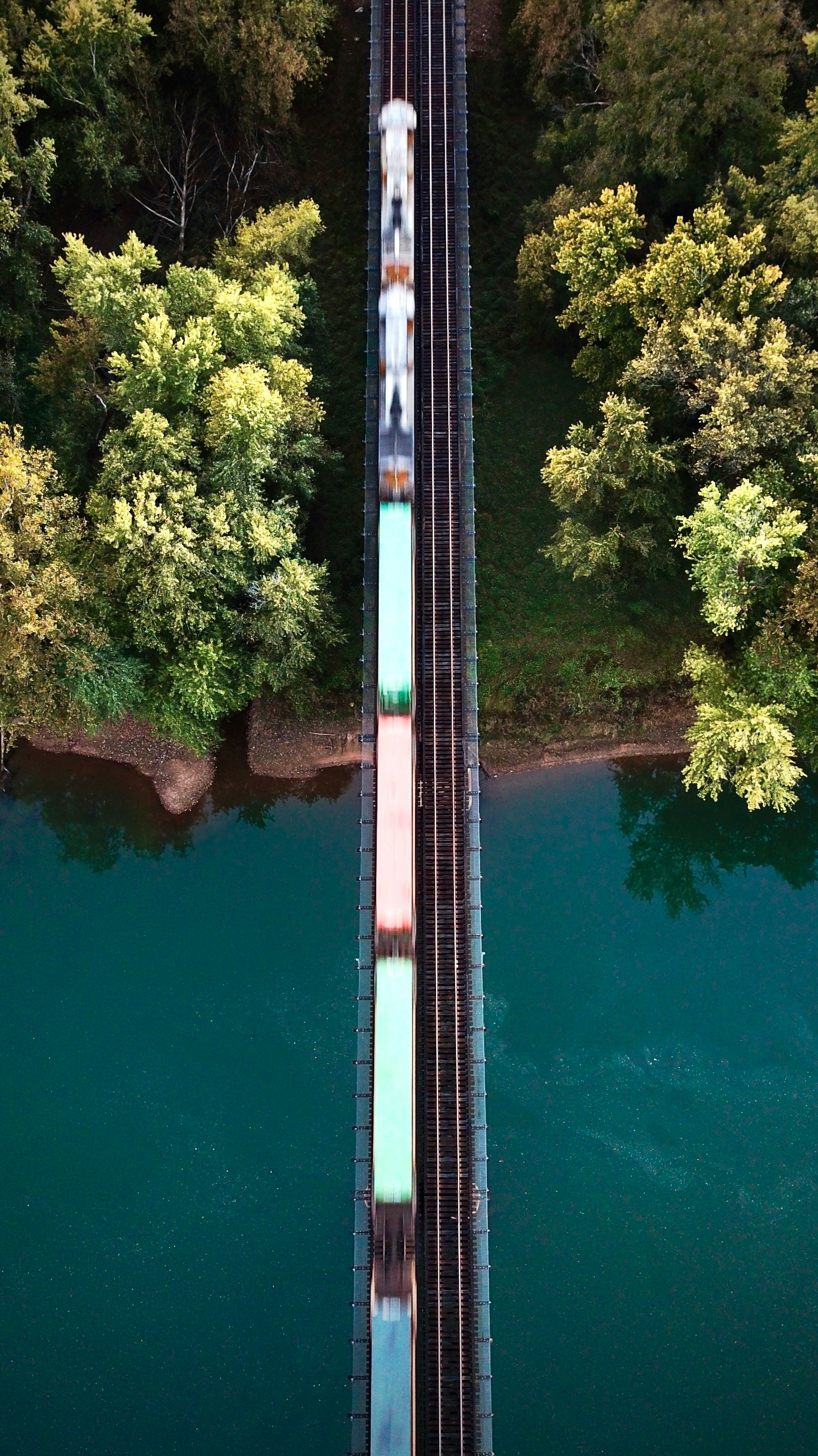 Aerial view of freight train on a bridge